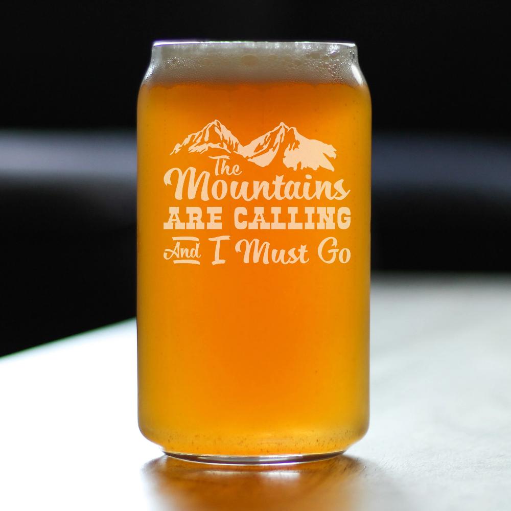 https://bevvee.com/cdn/shop/products/mountains_are_calling_beer_can_pint_glass_lifestyle_square_1200x.jpg?v=1670012728